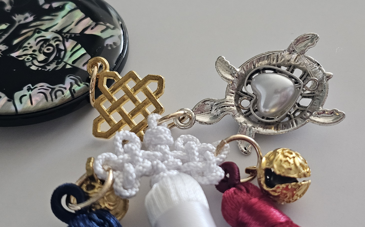 A turtle-shaped ornament with a heart attached to a handmade norigae [SHIN HA-NEE]