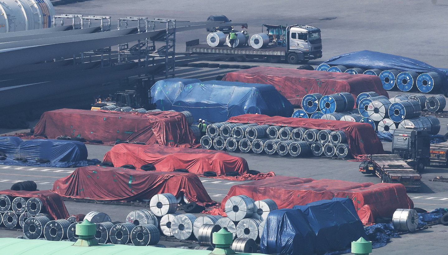Steel products await shipment abroad at a port in Pyeongtaek, Gyeonggi, on March 12. [YONHAP]