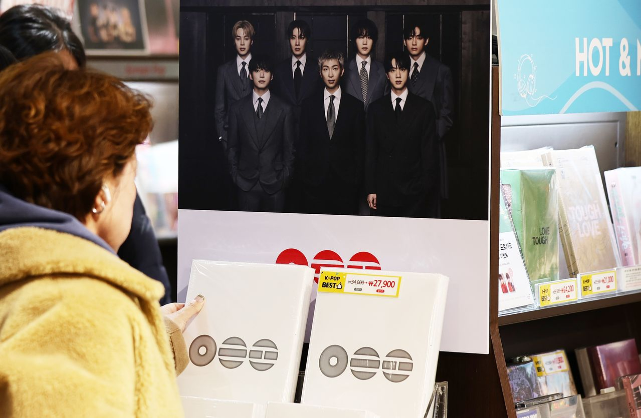 A person looks at BTS's new album "Arirang" being sold at a store in central Seoul on March 20. [NEWS1]