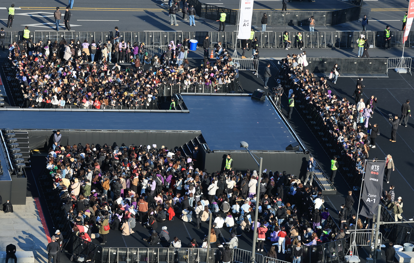 Concertgoers enter the standing section close to the stage installed at Gwanghwamun Square for boy band BTS's live performance, titled ″BTS The Comeback Live: Arirang,″ on March 21. [NEWS1]