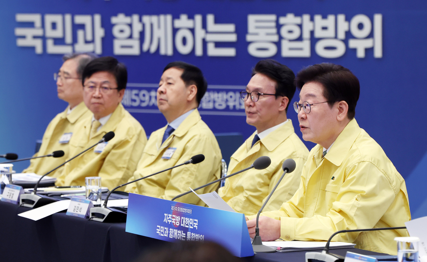President Lee Jae Myung, right, speaks during an integrated defense posture meeting at the Blue House in central Seoul on March 23. [JOINT PRESS CORPS] 
