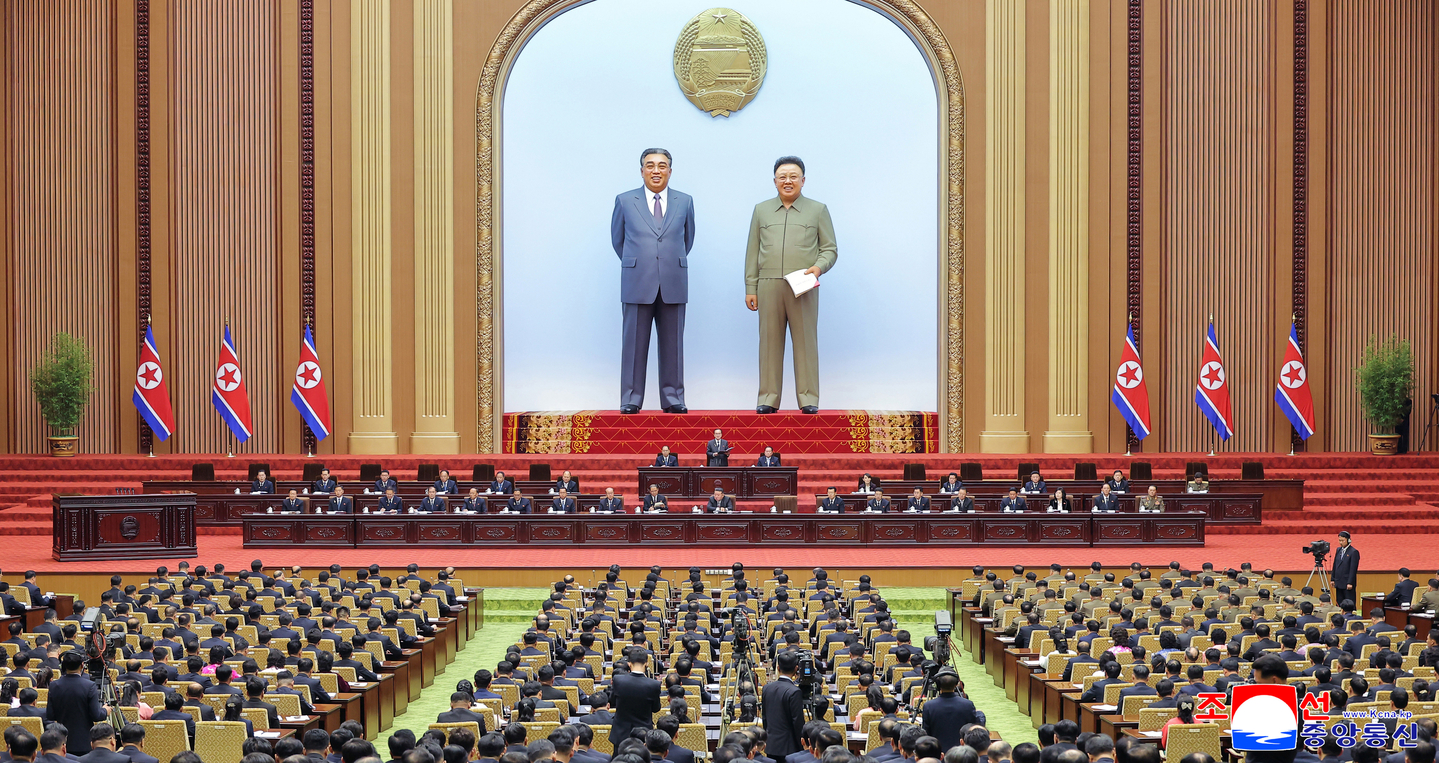 North Korean leader Kim Jong-un, center in the second row from back, presides over the first-day session of the 15th Supreme People’s Assembly in Pyongyang on March 22, where he was reappointed as chairman of the state affairs commission, in this photo carried by the Korean Central News Agency on March 23. [YONHAP]