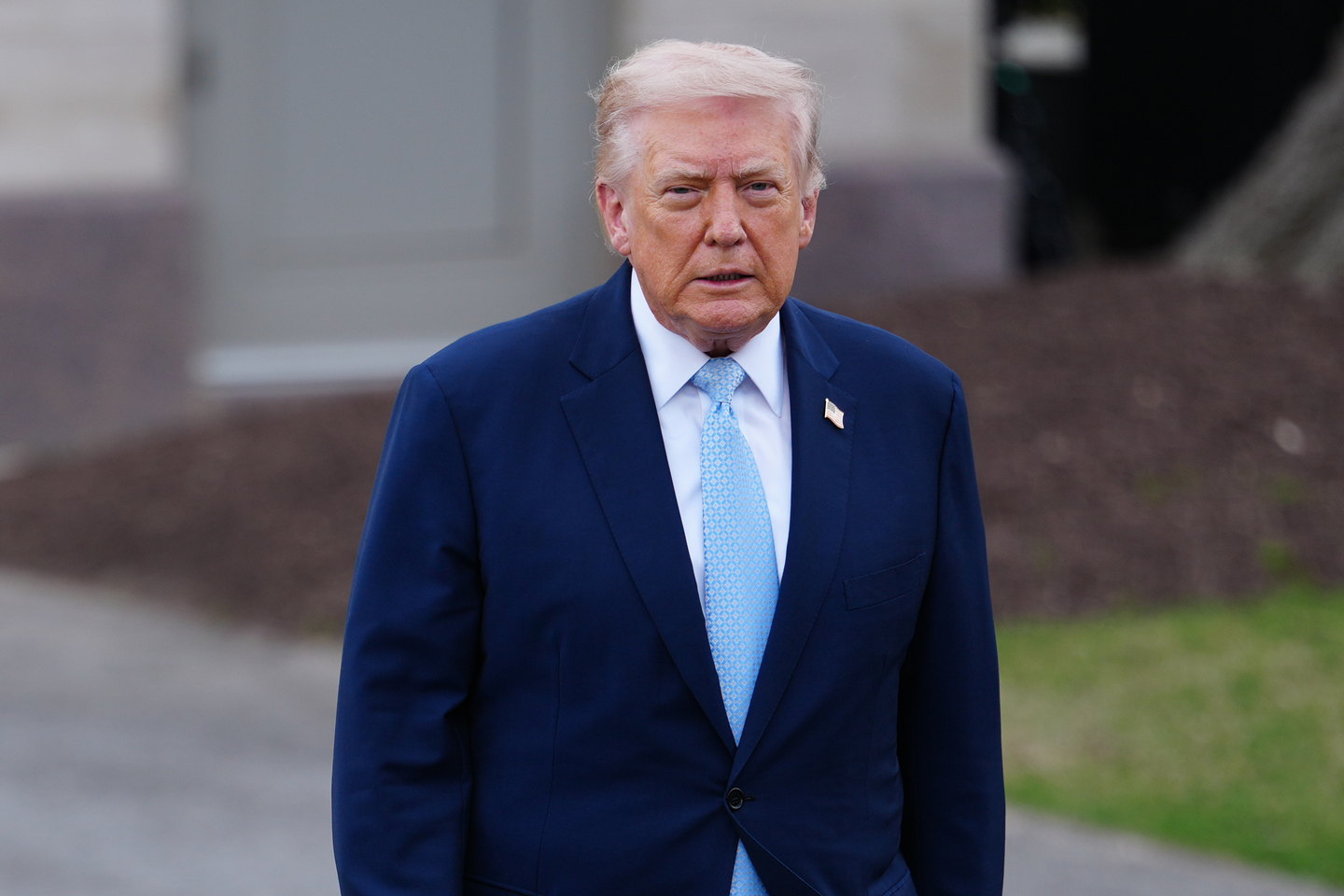 U.S. President Donald Trump walks to speak with reporters before departing on Marine One from the South Lawn of the White House in Washington on March 20. [AP/YONHAP] 