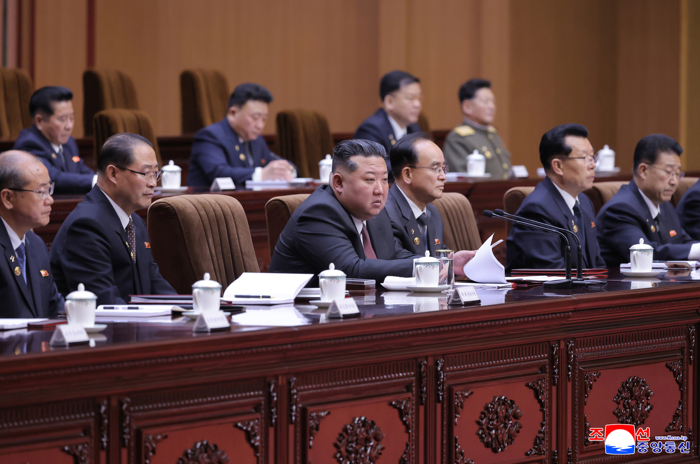 North Korean leader Kim Jong-un, center, presides over the first-day session of the 15th Supreme People’s Assembly in Pyongyang on March 22, where he was reappointed as chairman of the state affairs commission, in this photo carried by the Korean Central News Agency on March 23. [YONHAP]