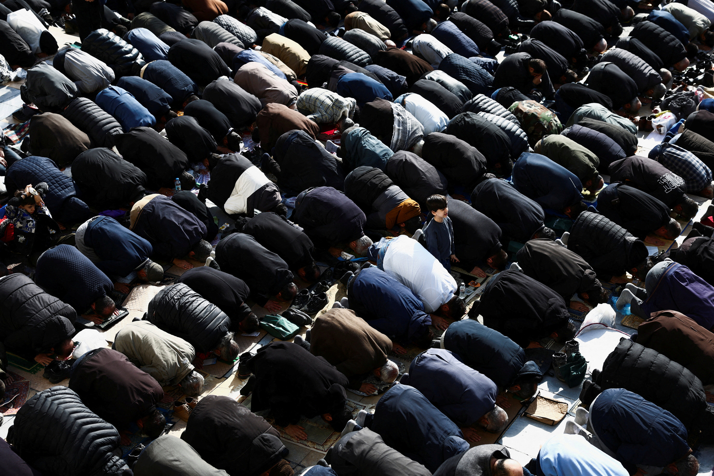 People attend Eid al-Fitr prayers, marking the end of Muslim holy fasting month of Ramadan, amid the U.S.-Israeli conflict with Iran, in Tehran, Iran, on March 21. [REUTERS/YONHAP]