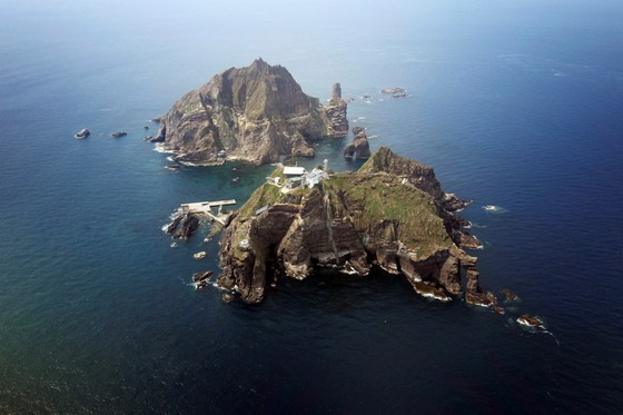A set of remote islands called Dokdo is seen in this picture taken from a helicopter on Aug. 10, 2012. [REUTERS/YONHAP] 