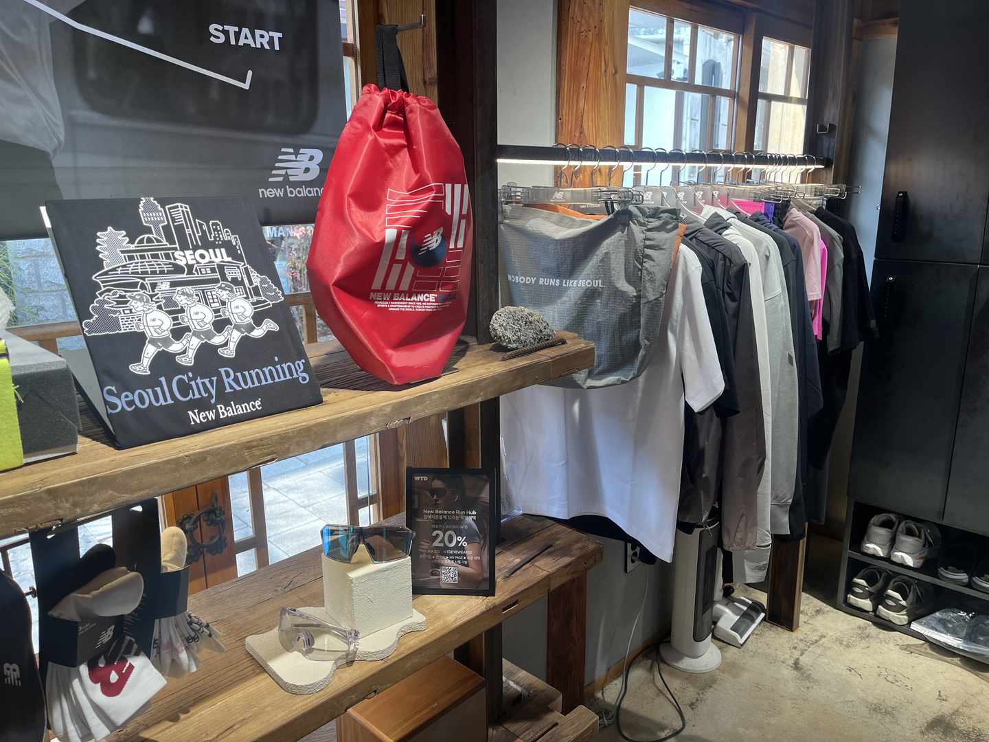 The running hub at the New Balance Bukchon store, in Jongno District, Seoul, feature racks of running gear available to rent, on March 17.  [ALICIA CARR]