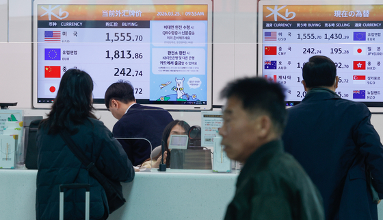 Exchange rate information for currencies such as the U.S. dollar and Japanese yen is displayed at a currency exchange counter at the Incheon International Airport on March 25. [NEWS1]