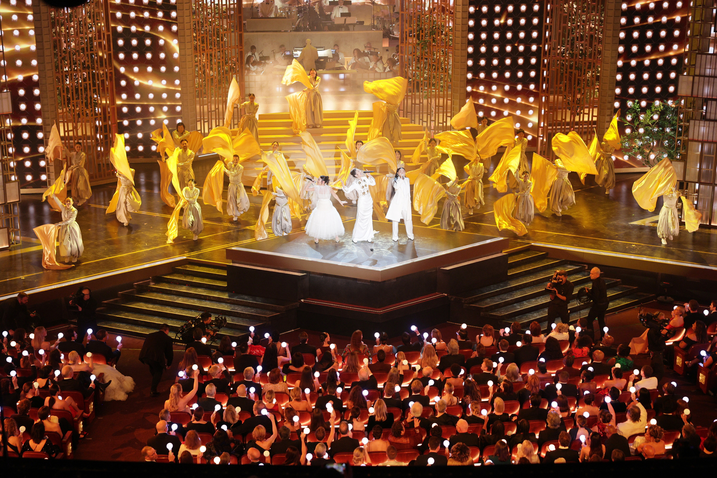 Rei Ami, EJAE and Audrey Nuna, in white from left, perform "Golden" (2025) from ″KPop Demon Hunters″ (2025) during the 98th annual Academy Awards ceremony at the Dolby Theatre in Los Angeles, California, on March 15. [EPA/YONHAP]
