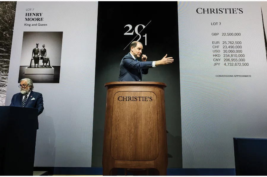 Adrien Meyer, Global Head of Private Sales & Co-Chairman, Impressionist & Modern Art, sells Henry Moore's "King and Queen" (1952-53) during Christie's 20th/21st-century Art Evening Sales in London on March 6. [CHRISTIE'S] 