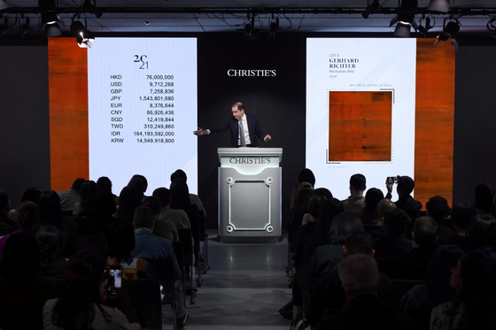 Auctioneer Adrien Meyer proceeds the bidding of “Abstrakes Bild” (1991) by Gerhard Richter during Christie’s Hong Kong 20th/21st Century Evening Sale at The Henderson in Central, Hong Kong, on March 27. [CHRISTIE'S]