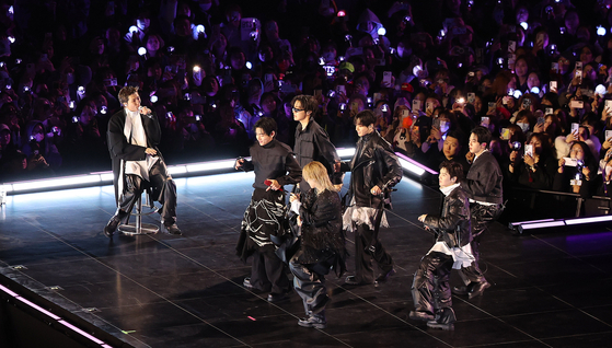 BTS members perform at Gwanghwamun Square in central Seoul on March 21, following the release of the band's fifth full-length album ″Arirang.″ [JOINT PRESS CORPS]