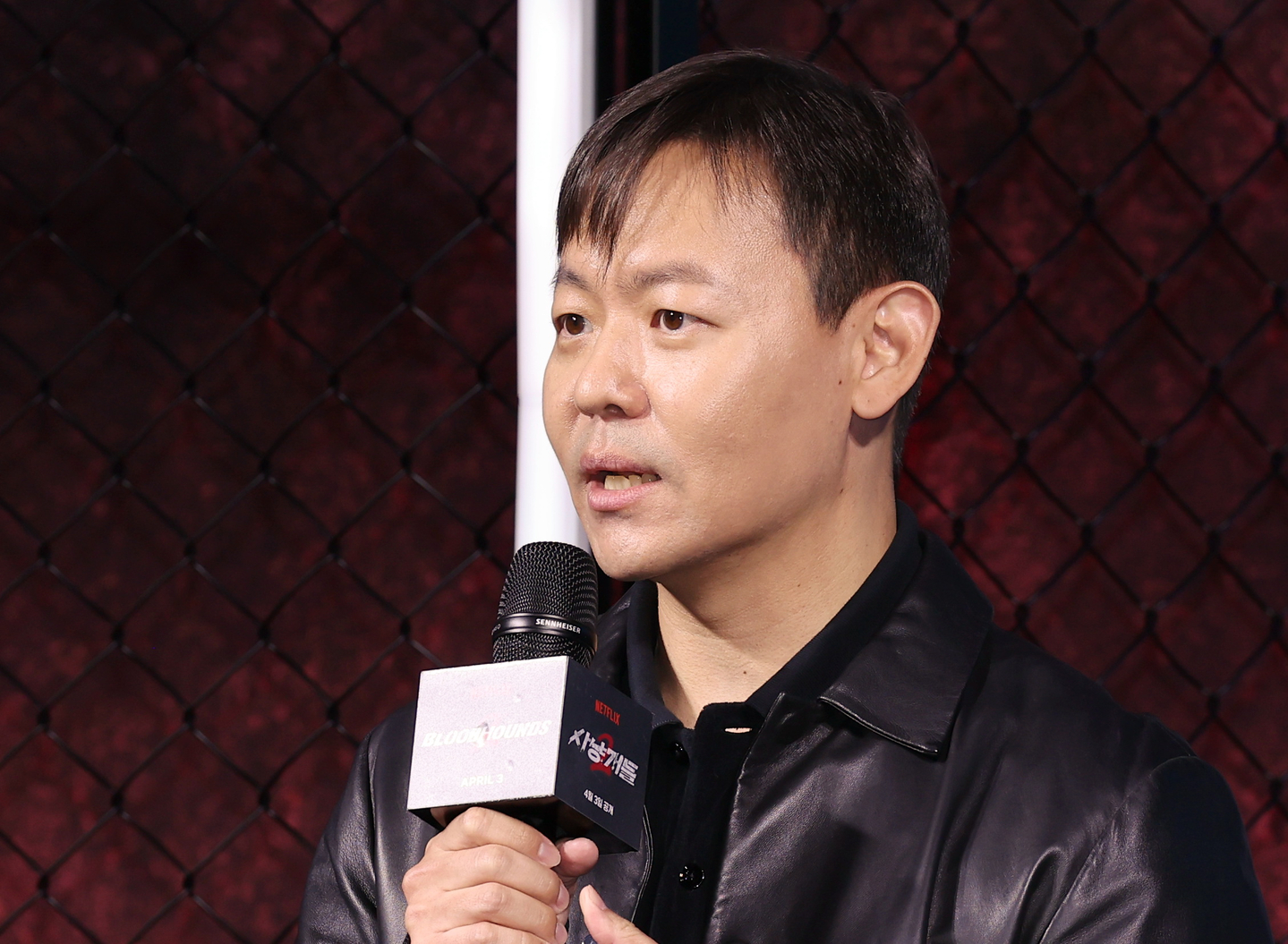 Director Kim Ju-hwan speaks during a press conference for the second season of Netflix's action series ″Bloodhounds″ (2023-) held in Jung District, central Seoul, on March 31. [YONHAP]