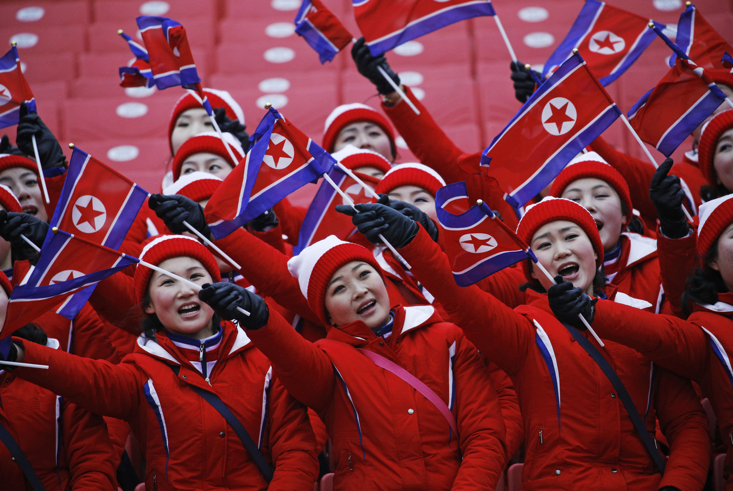 Members of the North Korean delegation wave flags at the women's slalom at the 2018 PyeongChang Winter Olympics in Pyeongchang, Gangwon, on Feb. 14, 2018. [AP/YONHAP] 