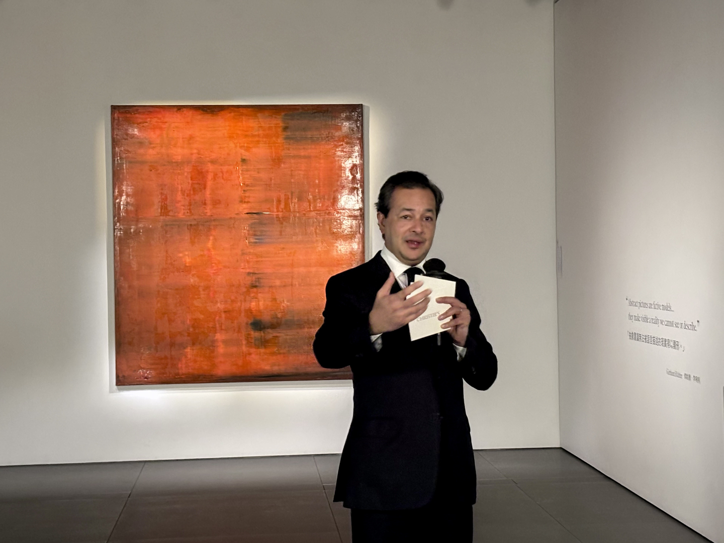 President of Christie's Asia Pacific, Rahul Kadakia, speaks to reporters at The Henderson in Central, Hong Kong, on March 24. Behind him is Gerhard Richter’s “Abstraktes Bild” (1991), which led the auction house's evening art sale on March 27 with $11.8 million, including fees. [LEE JIAN]