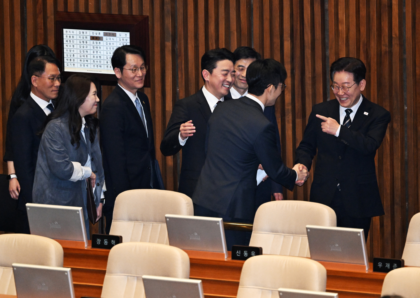 President Lee Jae Myung, far right, greets Rep. Park Choong-kwon of the People Power Party after delivering a policy speech on a supplementary budget to address the Iran war at the National Assembly in Yeouido, western Seoul, on April 2. [JOINT PRESS COPRS]
