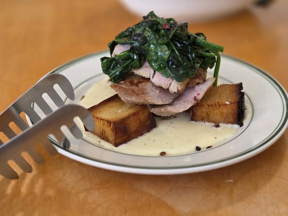 Pork tenderloin steak on top of potato rösti at Comida QQQ [JIN EUN-SOO]