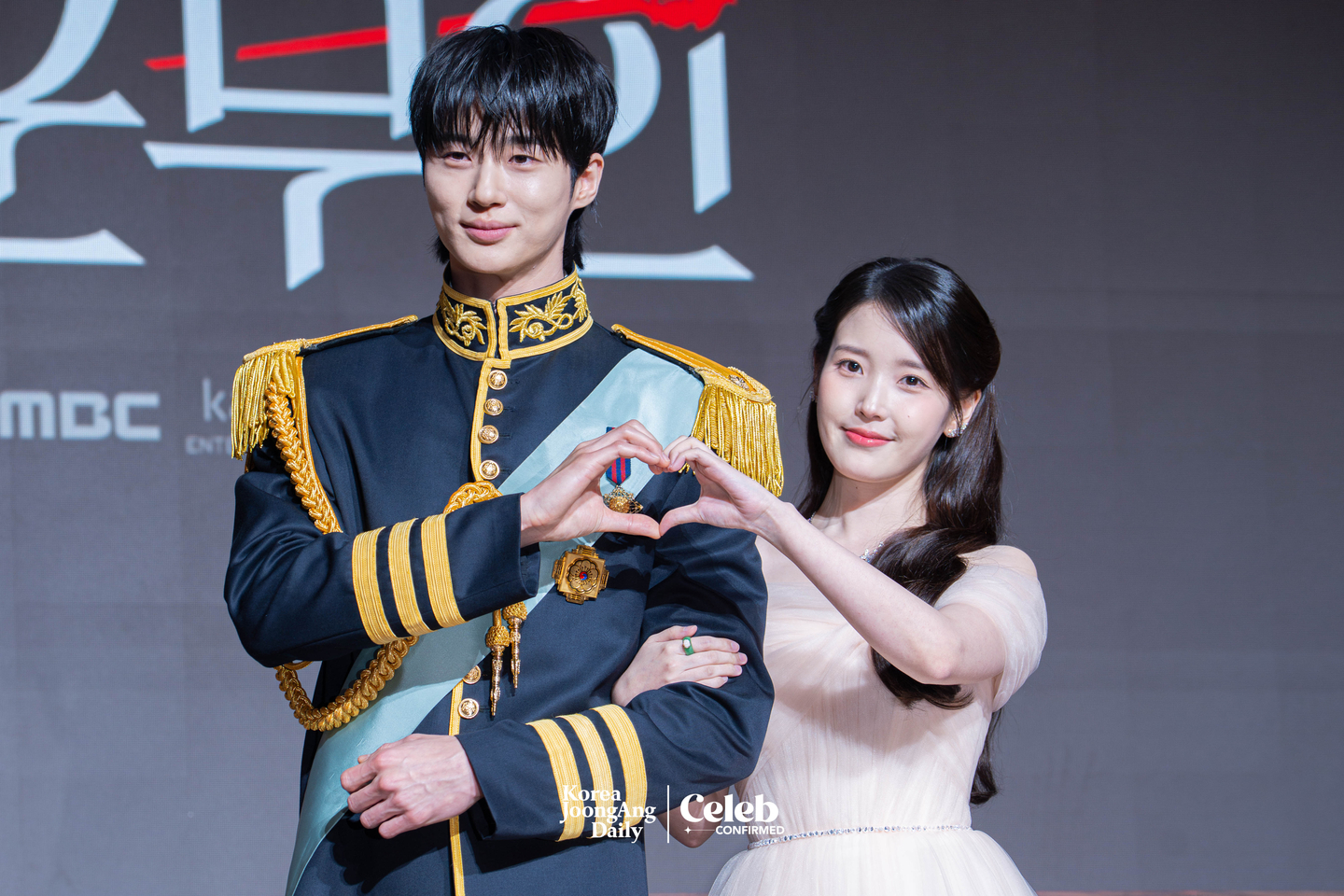 Actors IU and Byeon Woo-seok pose for photos during a press conference for the MBC series “Perfect Crown″ at the Josun Palace Hotel in Gangnam District, southern Seoul, on April 6. [DANIELA GONZALEZ PEREZ]