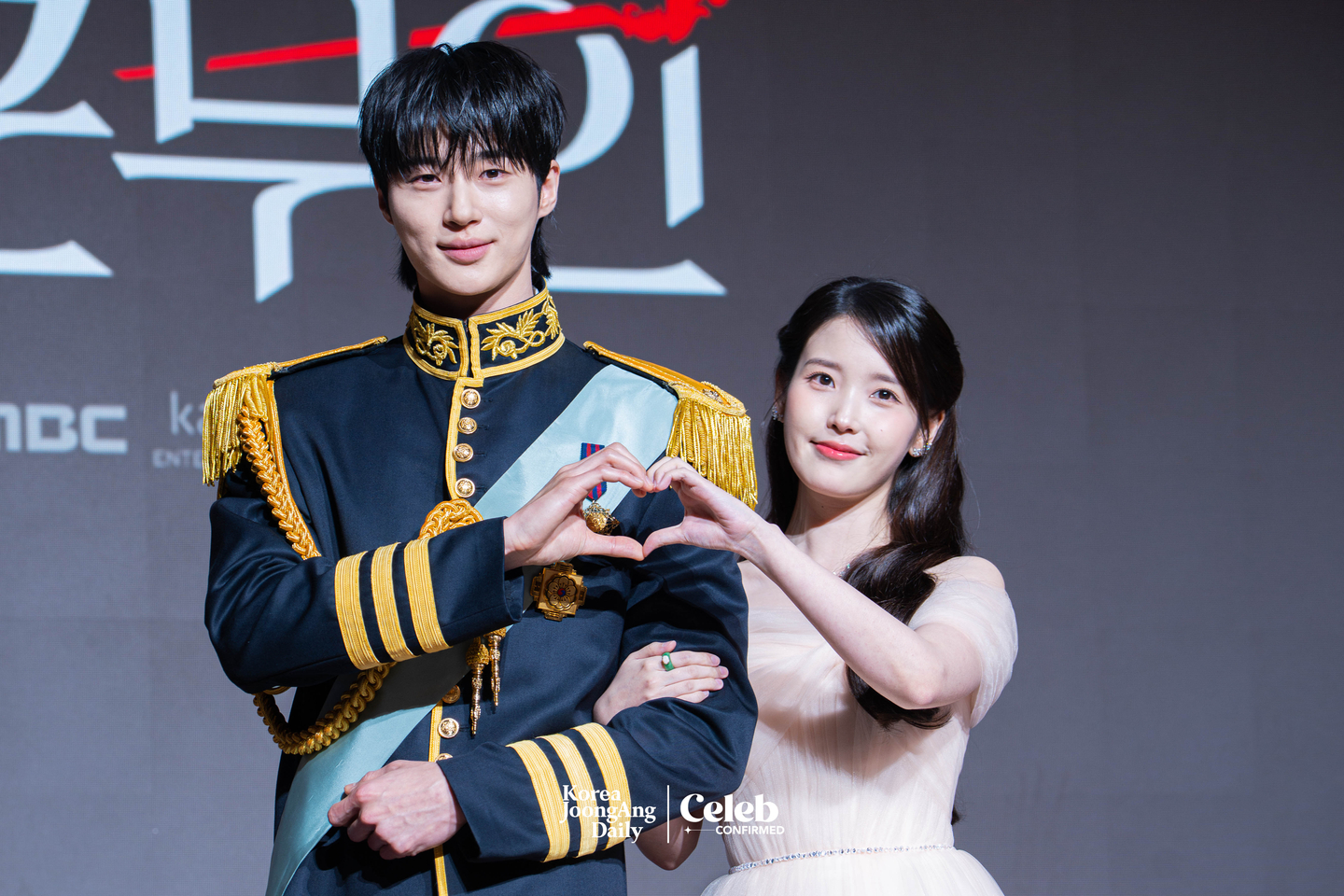 Actors IU and Byeon Woo-seok pose for photos during a press conference for the MBC series “Perfect Crown″ at the Josun Palace Hotel in Gangnam District, southern Seoul, on April 6. [DANIELA GONZALEZ PEREZ]
