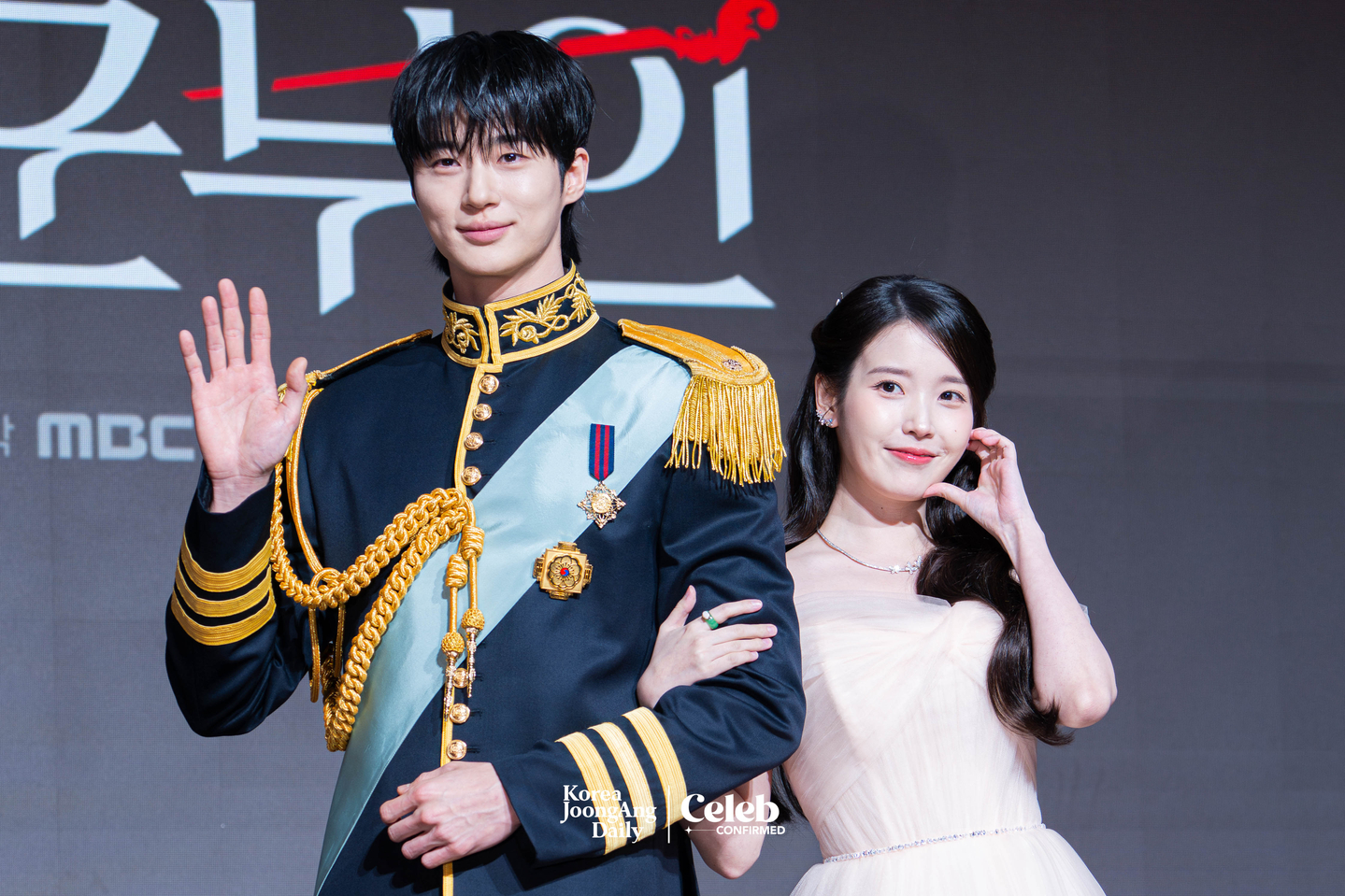Actors IU and Byeon Woo-seok pose for photos during a press conference for the MBC series “Perfect Crown″ at the Josun Palace Hotel in Gangnam District, southern Seoul, on April 6. [DANIELA GONZALEZ PEREZ]