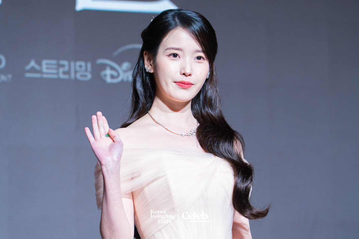 Singer and actor IU poses for photos during a press conference for the MBC series “Perfect Crown″ at the Josun Palace Hotel in Gangnam District, southern Seoul, on April 6. [DANIELA GONZALEZ PEREZ]