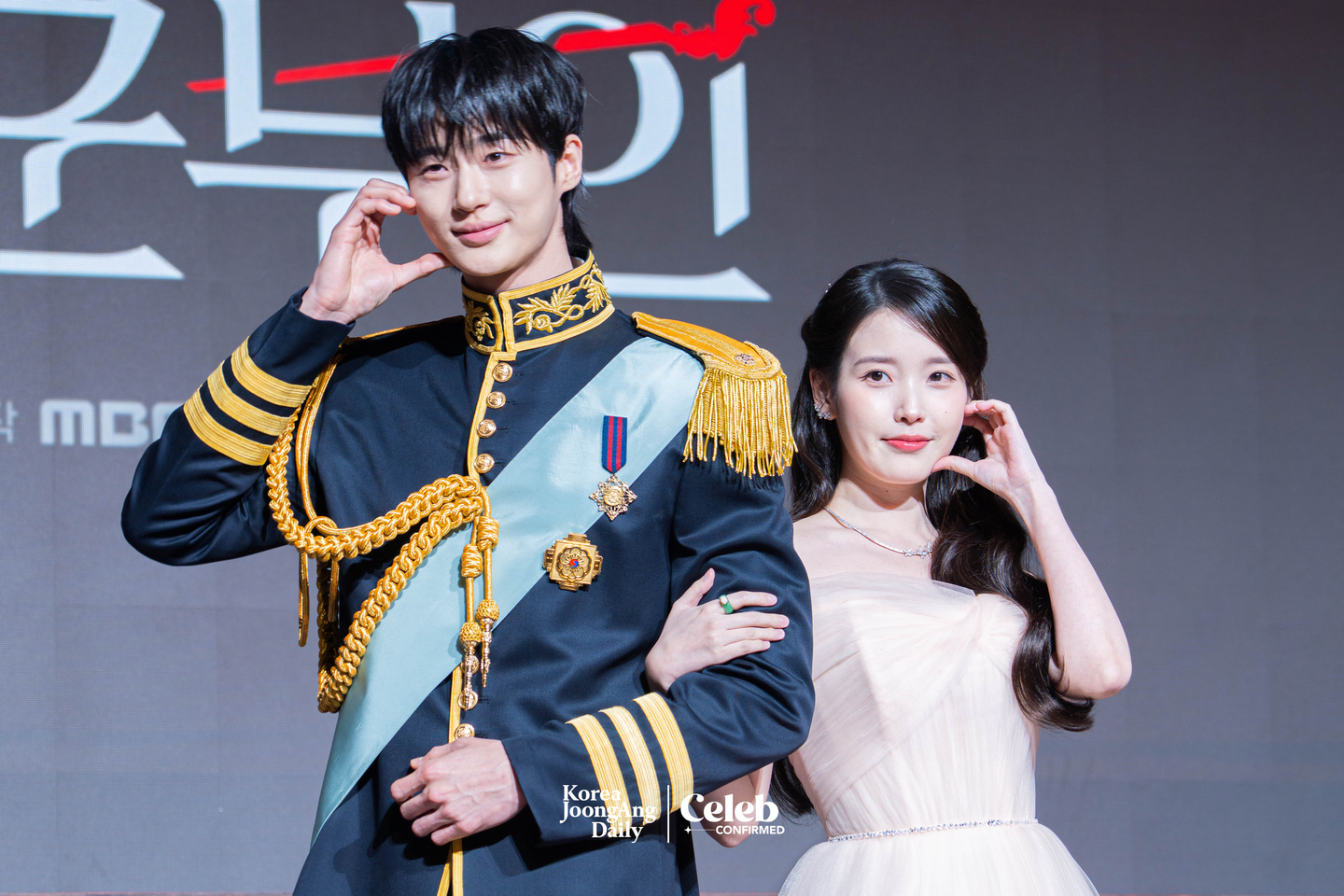 Actors IU and Byeon Woo-seok pose for photos during a press conference for the MBC series “Perfect Crown″ at the Josun Palace Hotel in Gangnam District, southern Seoul, on April 6. [DANIELA GONZALEZ PEREZ]