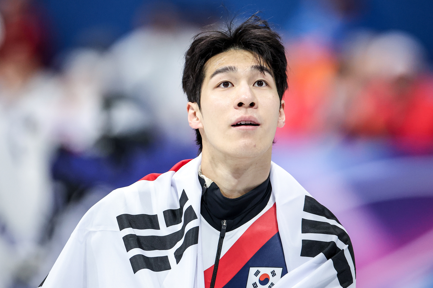 Hwang Dae-heon of Korea celebrates finishing second in Final A of the men's 1,500 meter short track speed skating event during the 2026 Winter Olympic Games at the Milano Ice Skating Arena in Milan, Italy. [TASS/YONHAP]