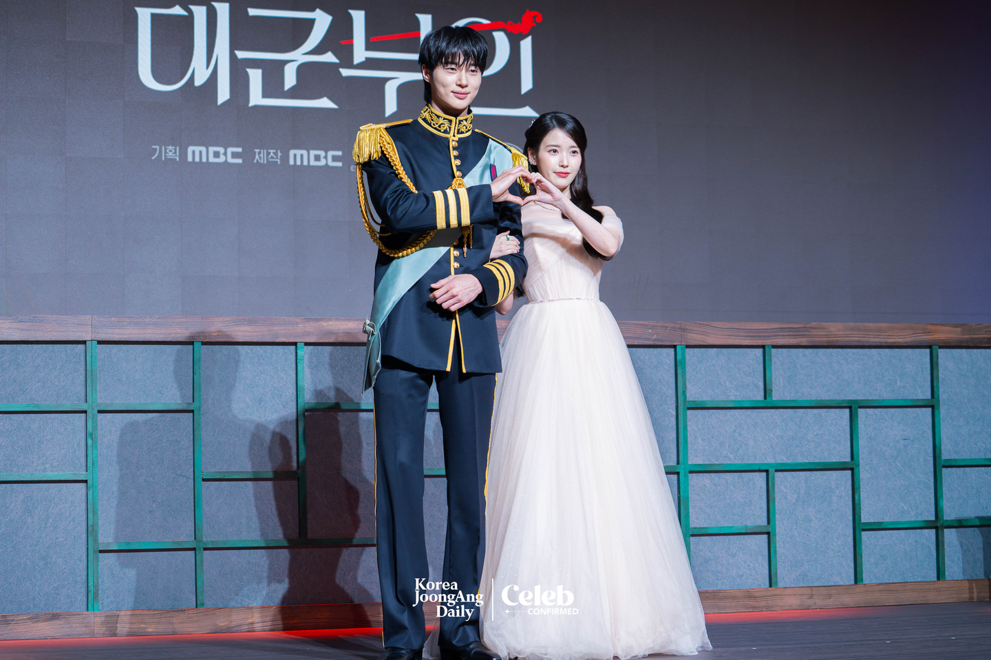 Actors IU and Byeon Woo-seok pose for photos during a press conference for the MBC series “Perfect Crown″ at the Josun Palace Hotel in Gangnam District, southern Seoul, on April 6. [DANIELA GONZALEZ PEREZ]