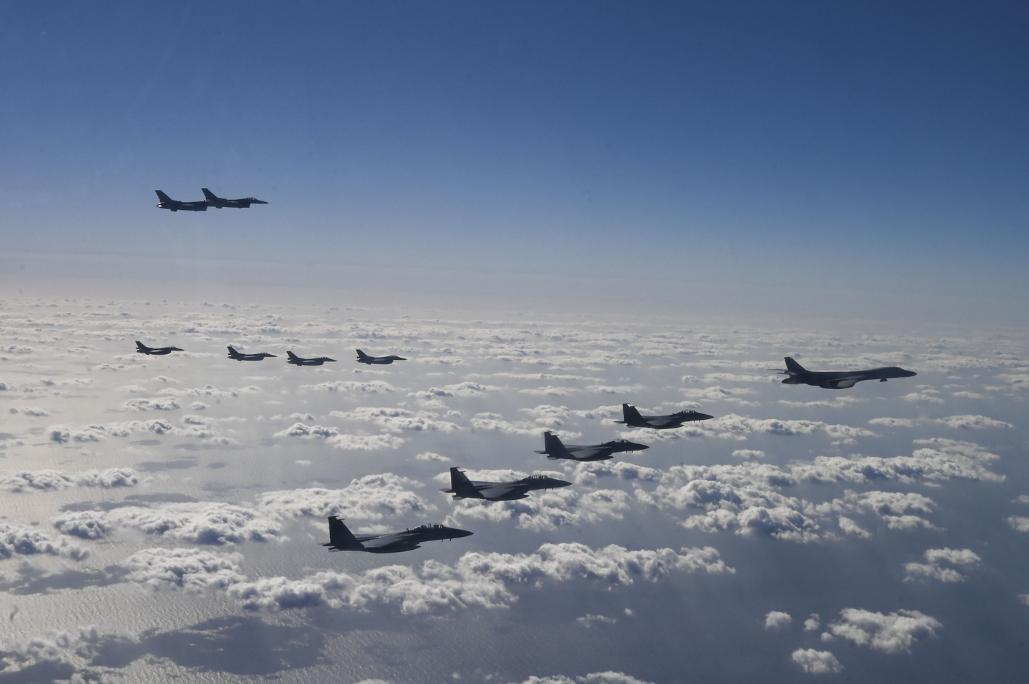 U.S. Air Force B-1B bombers, F-16 fighter jets, Korean Air Force F-15K fighter jets and Japanese Air Force F-2 fighter jets fly during a trilateral air drill at an undisclosed location on Nov. 3, 2024. [US AIR FORCE/AP/YONHAP] 