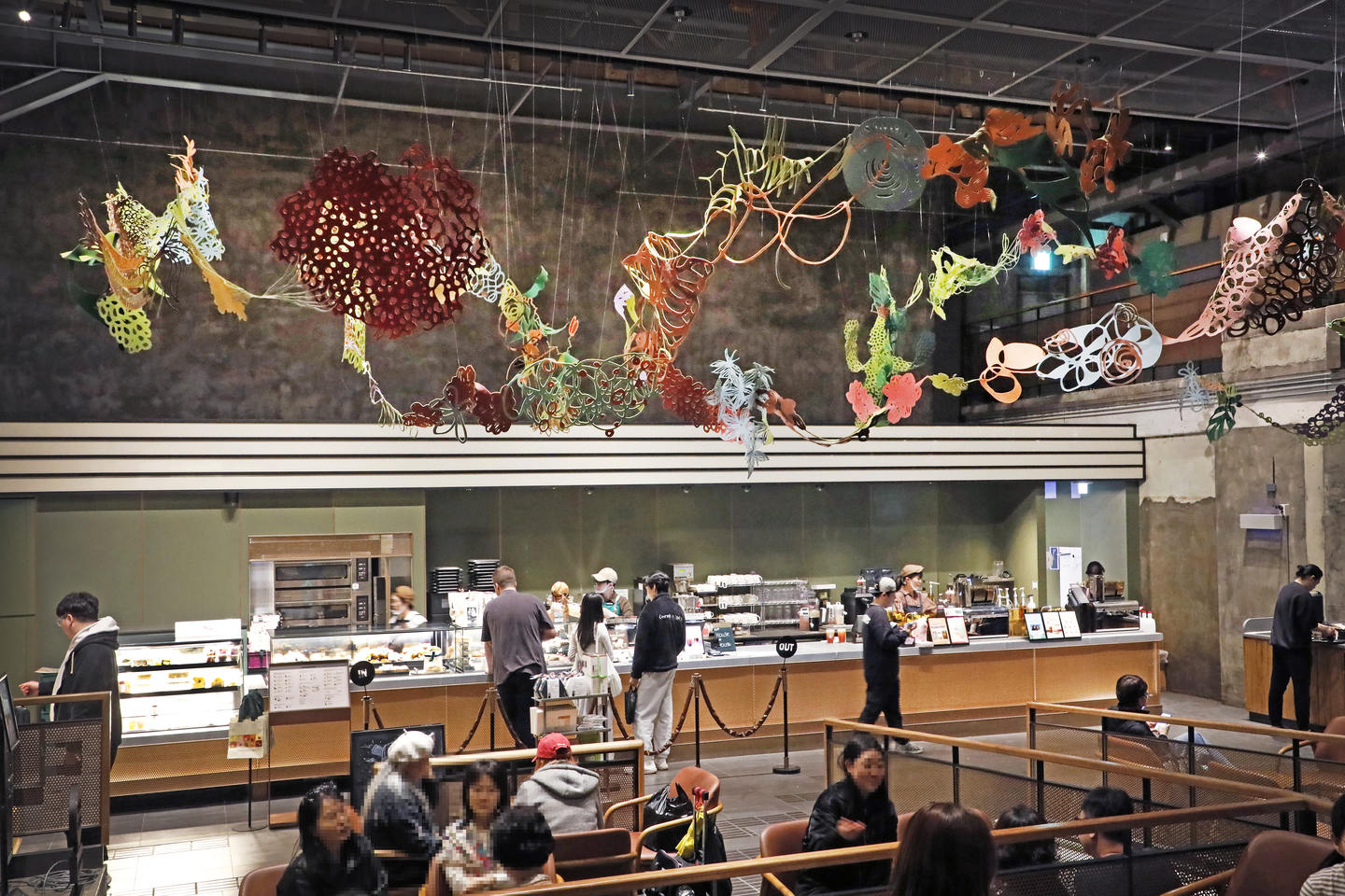 A specialty art piece symbolizing community hangs from the ceiling at the Gyeongdong 1960 Starbucks store in Dongdaemun district, eastern Seoul, on April 3. [PARK SANG-MOON]