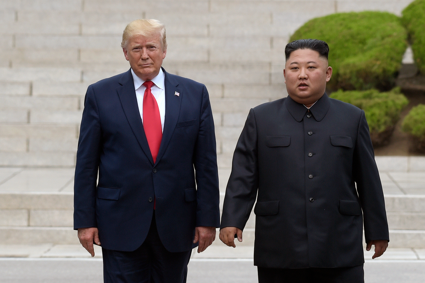 U.S. President Donald Trump, left, meets with North Korean leader Kim Jong-un at the inter-Korean border village of Panmunjom in the demilitarized zone on June 30, 2019. [AP/YONHAP]