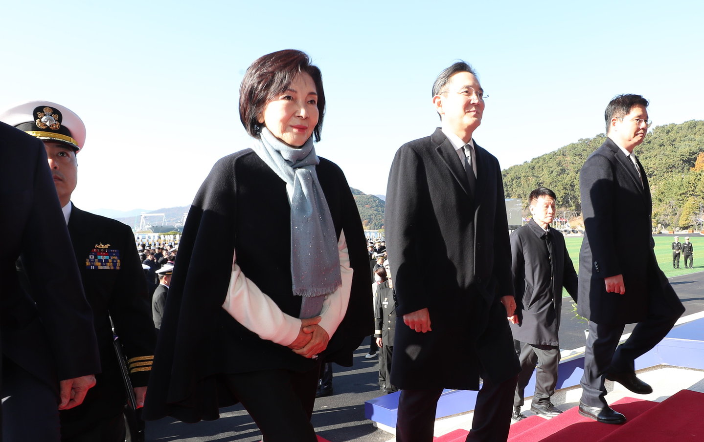 Hong Ra-hee, left, the widow of late Samsung Group Chairman Lee Kun-hee, is seen walking with her son and Samsung Electronics Chairman Lee Jae-yong at the Republic of Korea Naval Academy in Changwon in November 2025. [JOINT PRESS CORPS] 