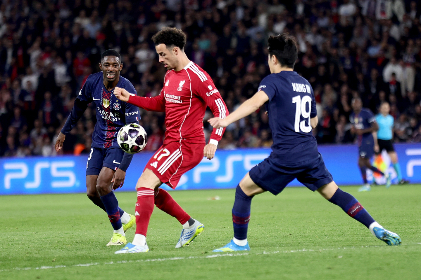 Ousmane Dembele, left, and Lee Kang-in, right of Paris Saint-Germain in action against Curtis Jones of Liverpool, center, during the UEFA Champions League quarter-finals, first leg match at Parc des Princes in Paris on April 8. [EPA/YONHAP]
