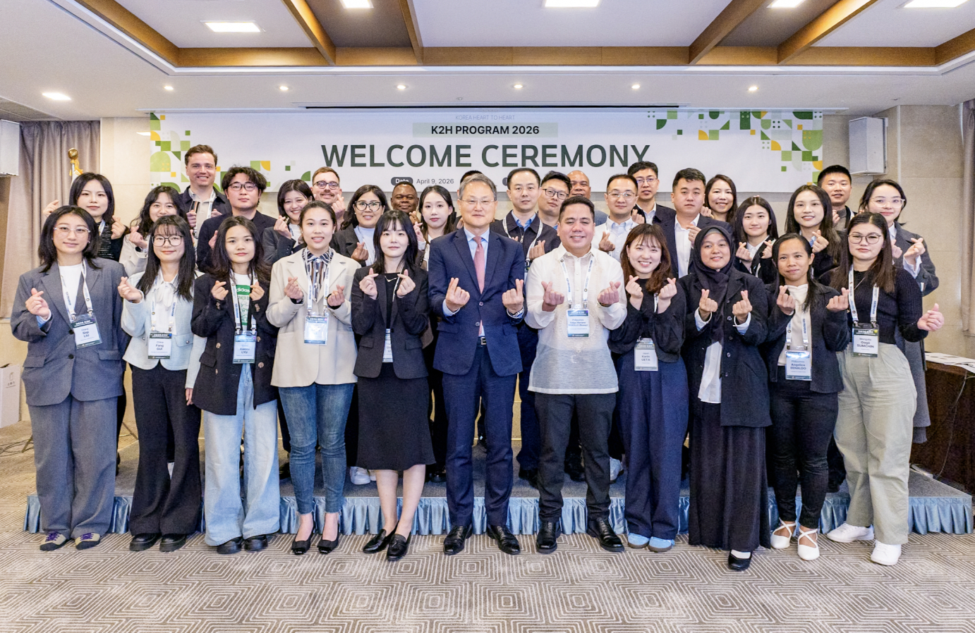 Chief of local diplomacy at the Governors Association of the Republic of Korea Lee Jang-keun, center, and participants in the 2026 Korea Heart to Heart fellowship program take a picture after their welcoming ceremony at the President Hotel in Jung District, central Seoul, on April 9. [GAOK]