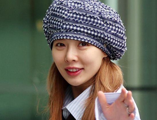 Singer HyunA waves to fans as she heads to the SBS television network building in Yangcheon District, western Seoul, on May 7, 2024. [NEWS1]