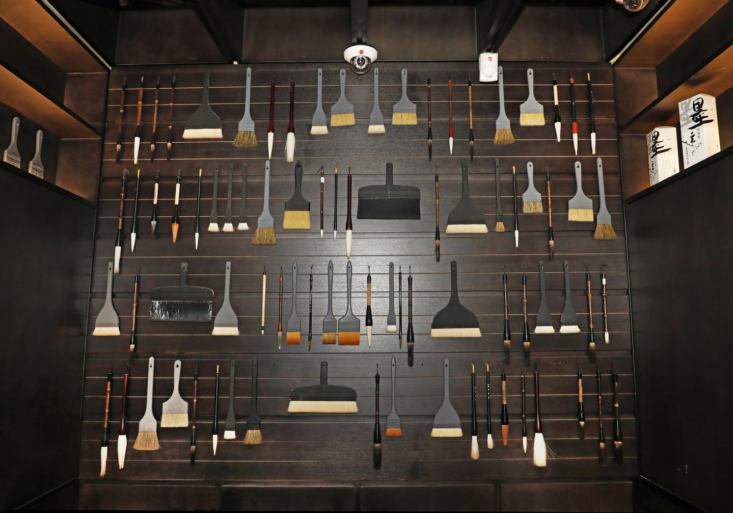 Assorted brushes are displayed on the wall in Kyochon Pilbang, the flagship store of one of Korea's biggest chicken franchises, in Itaewon, central Seoul, on April 7. [PARK SANG-MOON] 