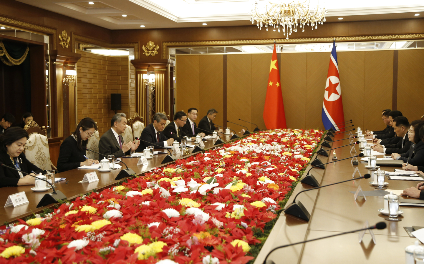 Chinese Foreign Minister Wang Yi, third from left, also a member of the Political Bureau of the Communist Party of China Central Committee, holds talks with North Korean Foreign Minister Choe Son-hui, first from right, in Pyongyang. [XINHUA/YONHAP]
