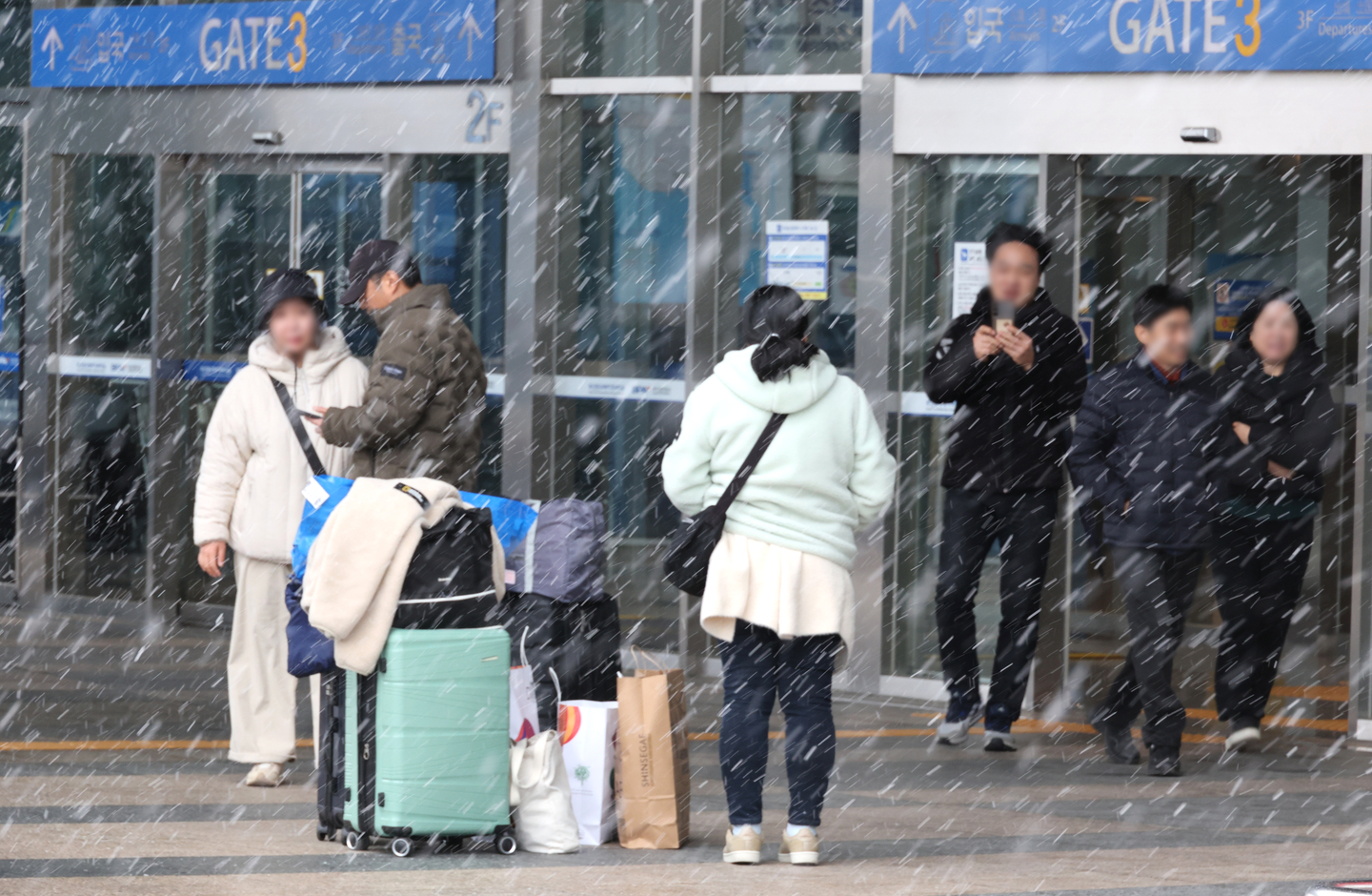 People are seen outside the passenger terminal at Busan Port in February. [YONHAP]  