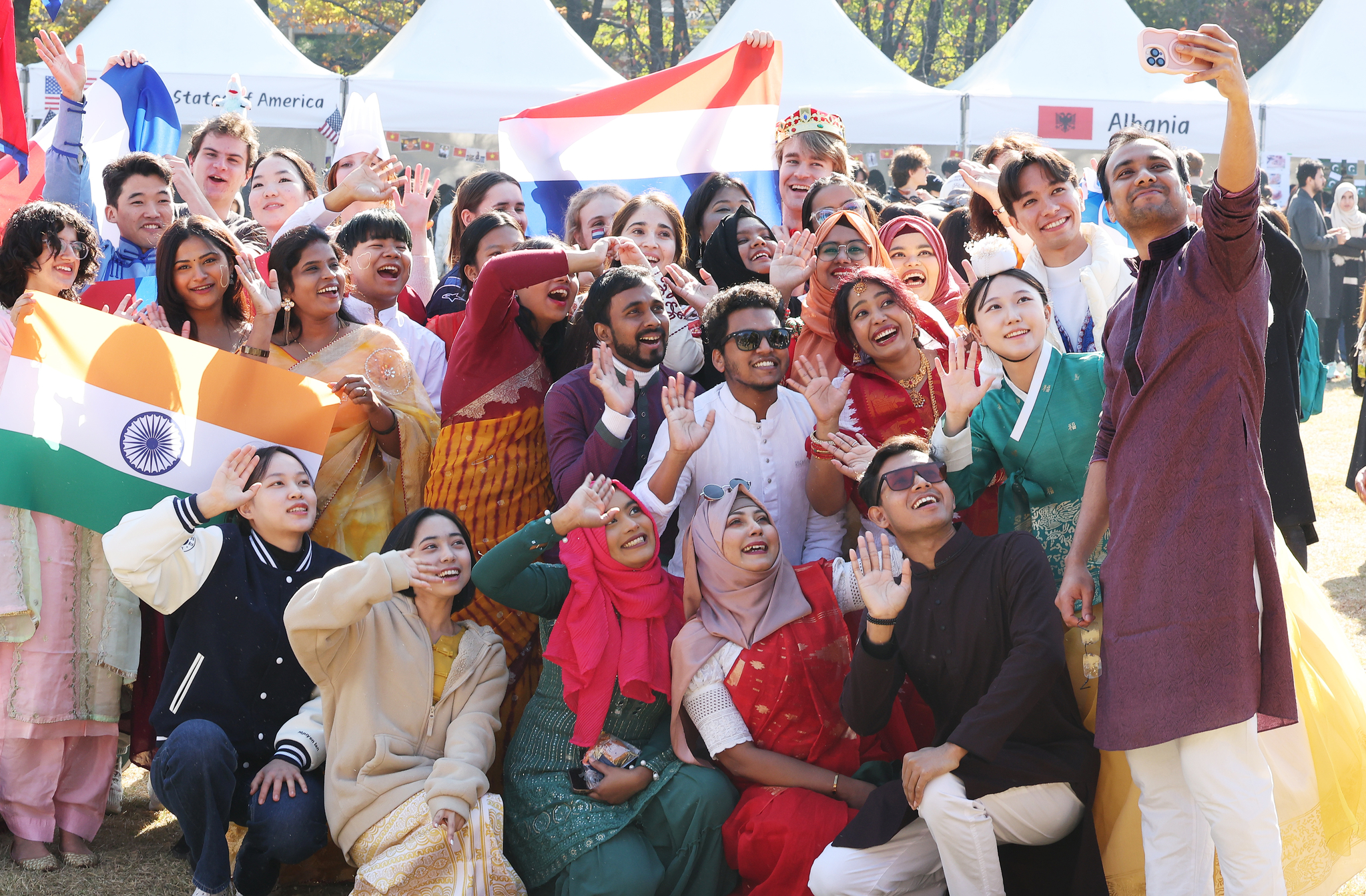 International students pose for a photo at a culture festival at Ajou University in Suwon on Nov. 7, 2024. [YONHAP]