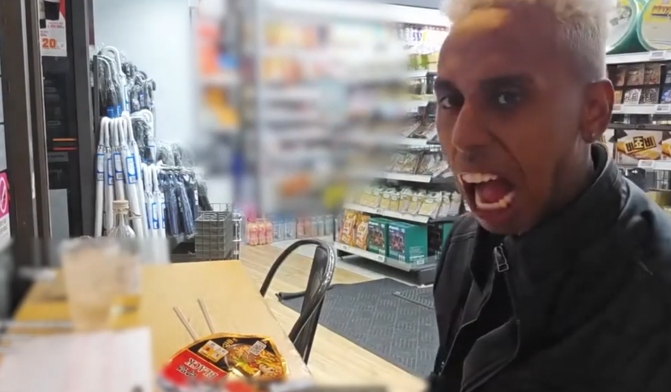 A still from a video uploaded by Johnny Somali on Oct. 17, 2024, shows the streamer hurling insults while inside a convenience store in Korea. In the same video, he is shown intentionally spilling ramyeon onto the table. [SCREEN CAPTURE]