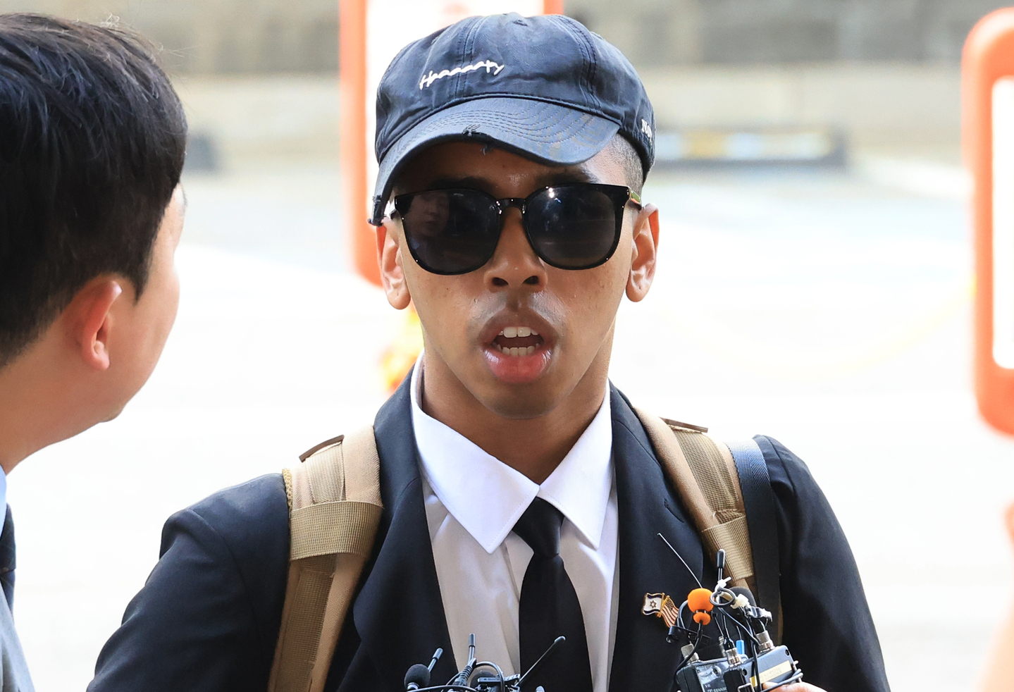 Johnny Somali arrives at the Seoul Western District Court in Mapo District, western Seoul, on April 15 to attend his sentencing hearing. [YONHAP]