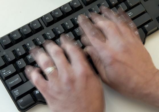 A man types on a keyboard in this photo taken in Washington, November 21, 2016. [AFP/YONHAP]