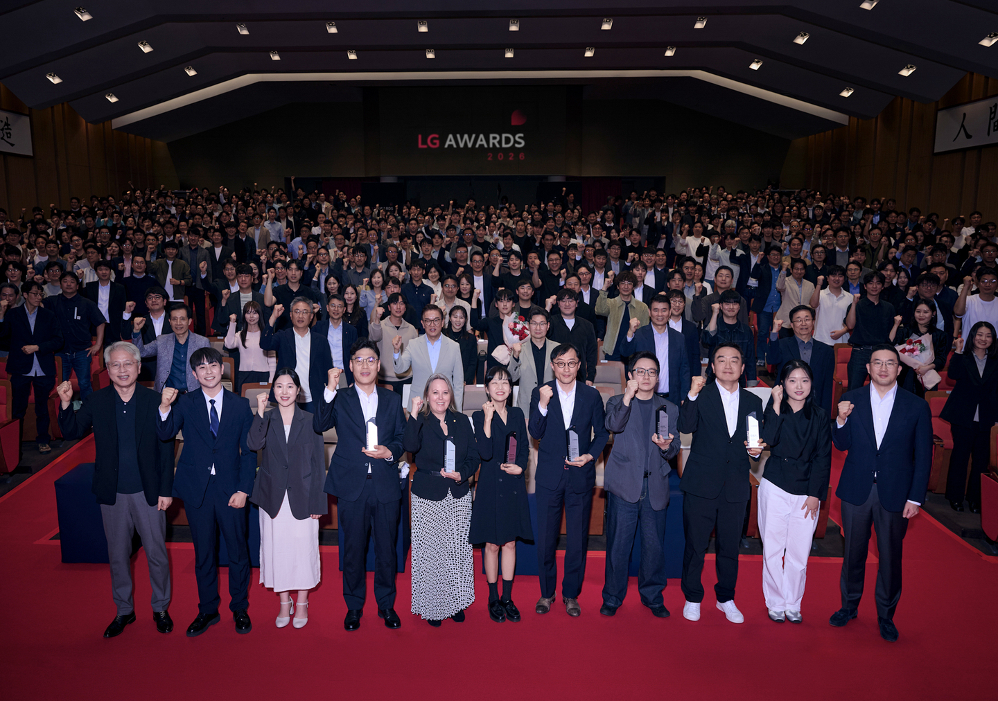 LG Group Chairman Koo Kwang-moo, far right in the front row, poses for a photo with prize winners at the 2026 LG Awards in Icheon, Gyeonggi, on April 16. [LG]  