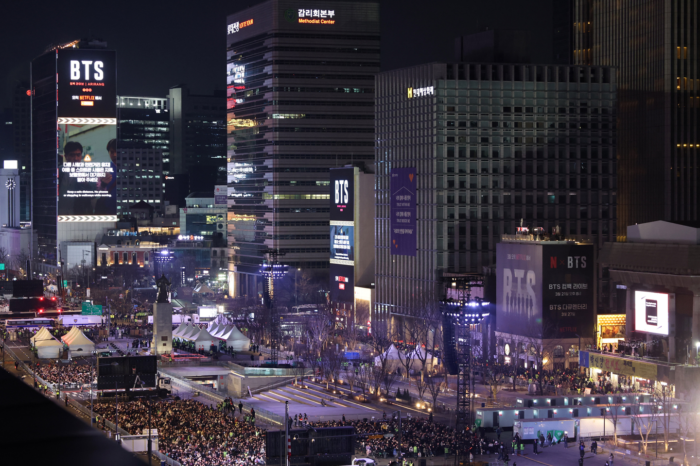 Digital billboards near Gwanghwamun Square in central Seoul display videos of boy band BTS ahead of their comeback performance on March 21. [JOINT PRESS CORPS] 