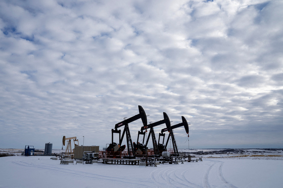 Oil pumpjacks operate in a farmer’s field near Calgary, Alberta, Canada, on Nov. 26, 2025. [REUTERS/YONHAP]