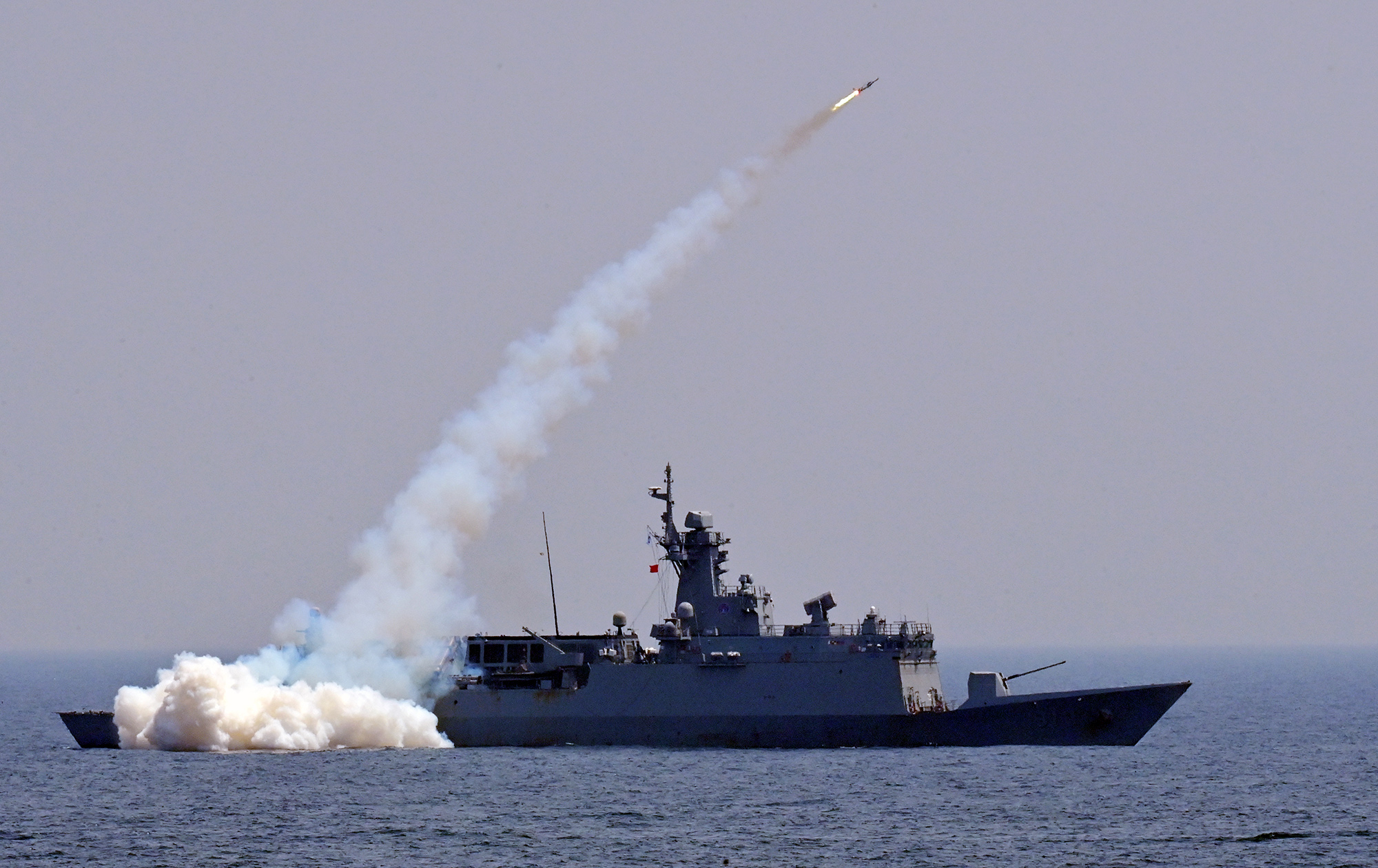 The Chuncheon FFG-II frigate launches Haegung surface-to-air missiles to shoot down an aerial target during live-fire drills held in the East Sea in 2024, in a photo provided by the South Korean Navy. [YONHAP]