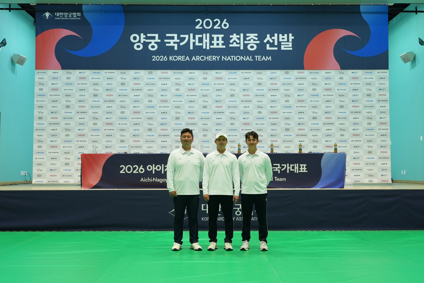 From left: Kim Woo-jin, Lee Woo-seok and Kim Je-deok pose for a photograph after securing their spots to compete at the 2026 Aichi-Nagoya Asian Games following qualifiers in Yecheon, North Gyeongsang, on April 17. [KOREA ARCHERY ASSOCIATION]