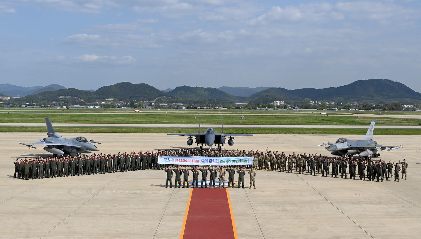 Mission personnel from the Korean and U.S. Air Forces pose for a commemorative photo in front of Korean and U.S. fighter jets in this image provided by the Korea Air Force. [KOREA AIR FORCE]