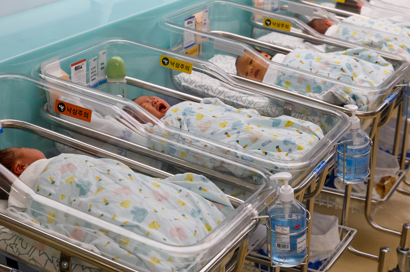 Newborn babies are seen in cradles in a nursery at a hospital in Gyeonggi on April 22. [NEWS1] 