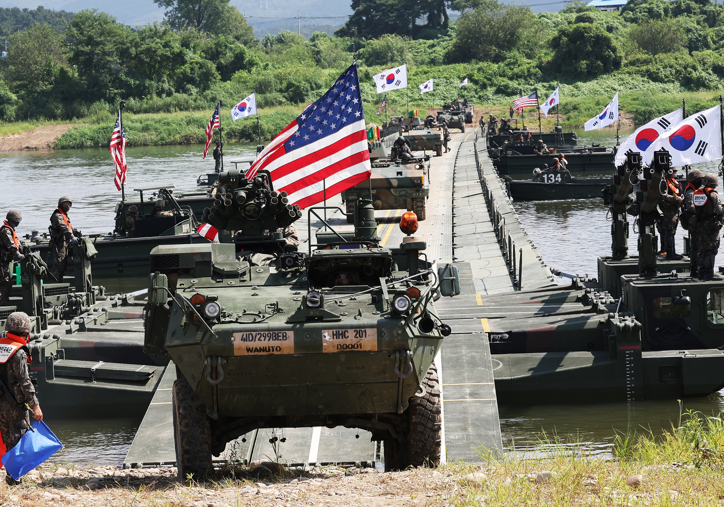 U.S. Forces Korea Stryker armored vehicles and Korean K200 armored vehicles are crossing a pontoon bridge during a combined exercise in Yeoju, Gyeonggi on Aug. 27, 2025. [YONHAP] 